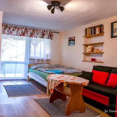 Деревянный коттедж Pod Krzywym Dachem Karpniki